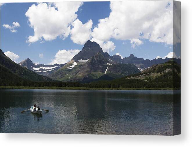 Rowboat Canvas Print featuring the photograph Rowboat at Many Glacier by Lorraine Devon Wilke