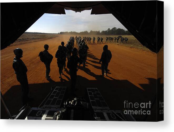 Battlefield Canvas Print featuring the photograph Soldiers Board A C-130 Hercules by Stocktrek Images