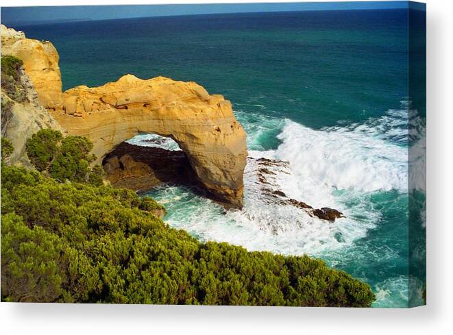 Arch Canvas Print featuring the photograph The Arch with Breaking Wave by Dennis Lundell