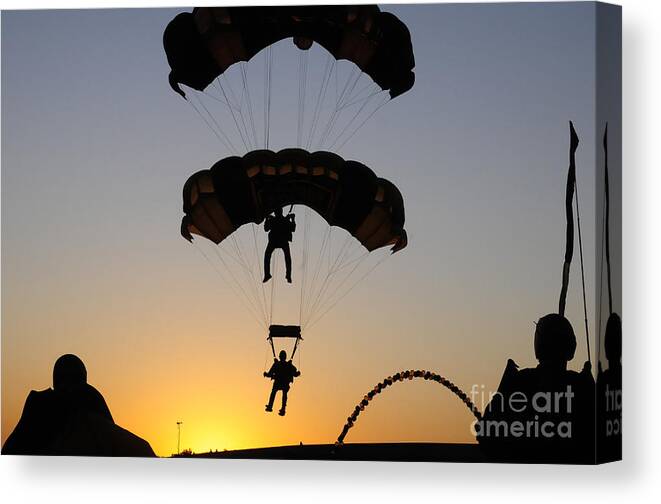 U.s. Army Golden Knights Canvas Print featuring the photograph The U.s. Army Golden Knights Perform An by Stocktrek Images