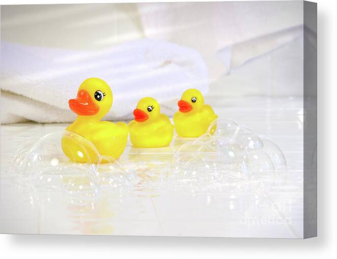 Water Canvas Print featuring the photograph Three little rubber ducks by Sandra Cunningham