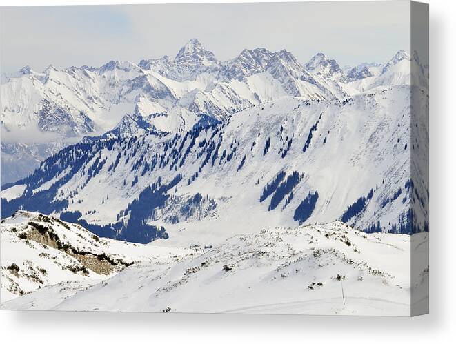 Mountains Canvas Print featuring the photograph Winter in the alps - snow covered mountains by Matthias Hauser
