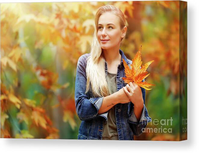 Adult Canvas Print featuring the photograph Beautiful girl enjoying autumn holidays #1 by Anna Om