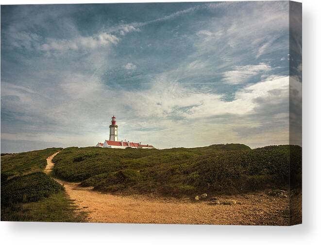 Sesimbra Canvas Print featuring the photograph Cape Espichel Lighthouse #1 by Carlos Caetano