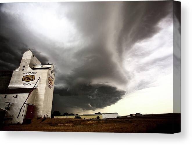 Grain Elevator Canvas Print featuring the digital art Nasty looking cumulonimbus cloud behind grain elevator #1 by Mark Duffy