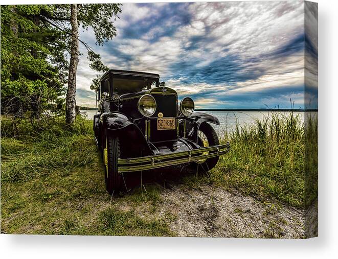 Higgins Lake Canvas Print featuring the photograph 1930 Chevy on the shore of Higgins Lake by Joe Holley