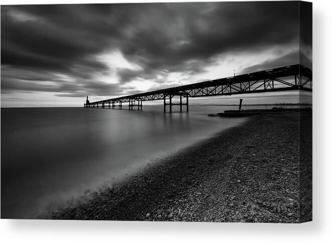 Seascape Canvas Print featuring the photograph Seascape with jetty during a dramatic cloudy sunset #2 by Michalakis Ppalis