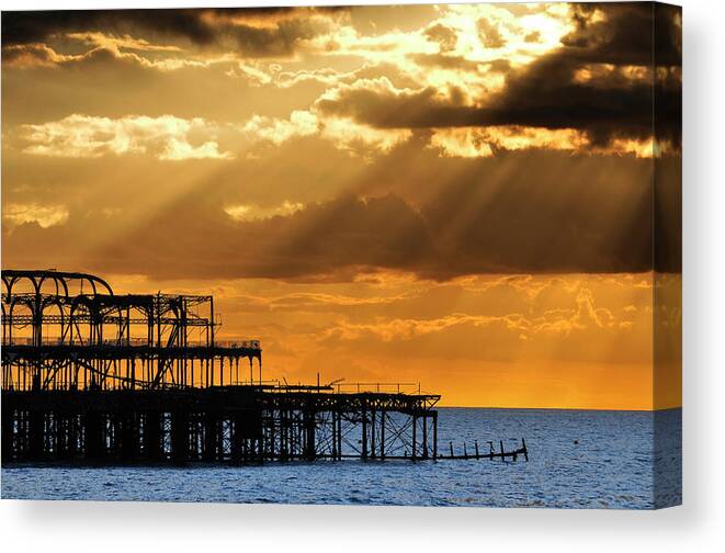 Brighton Canvas Print featuring the photograph The West Pier in Brighton at sunset #3 by Dutourdumonde Photography