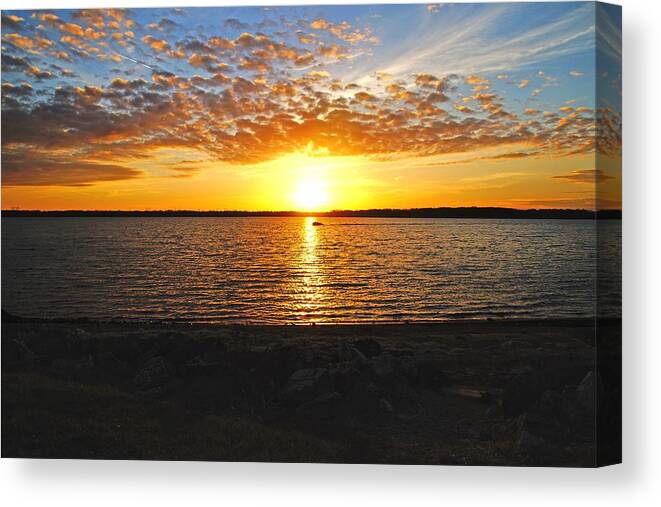 Sunset Canvas Print featuring the photograph A Boat in the Evening by Mike Murdock