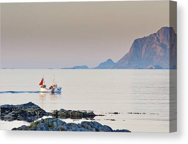 Landscape Canvas Print featuring the photograph A fishing boat comes in from the sea by Ulrich Kunst And Bettina Scheidulin