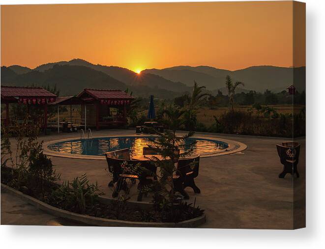 Golden Canvas Print featuring the photograph A Golden Sunset in Loas by Nathaniel H Broughton