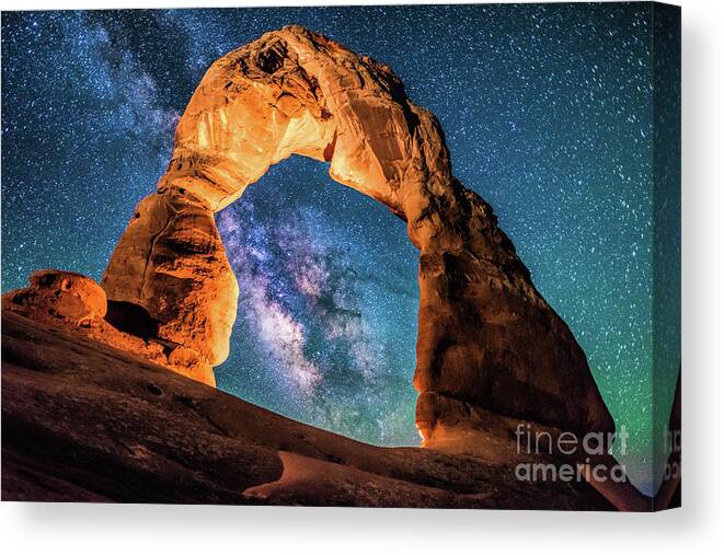 Delicate Arch Canvas Print featuring the photograph A Portal to the Milky Way at Delicate Arch by Robert Loe