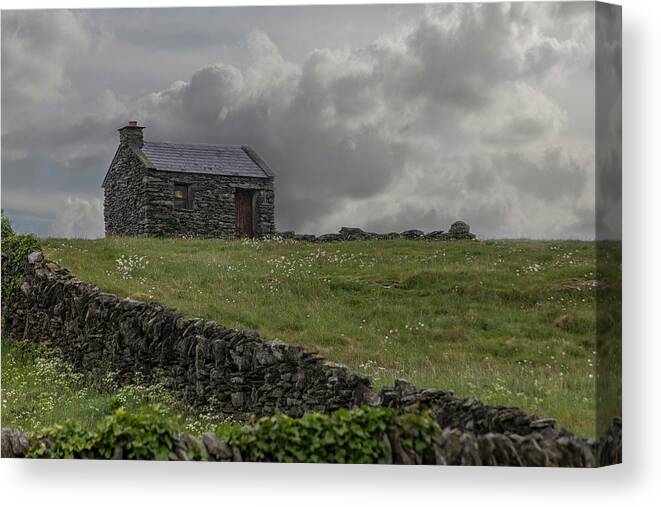 Innis Oirr Canvas Print featuring the photograph A Stone House on the Hill by Teresa Wilson