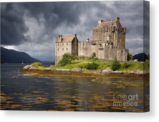 Castle Canvas Print featuring the photograph A storm brews over Eilean Donan Castle by Jane Rix