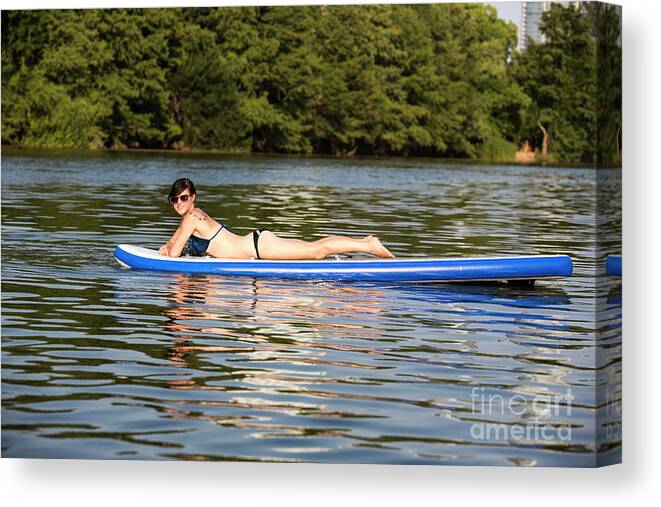Woman Canvas Print featuring the photograph A woman having a great time sunning for suntan by Dan Herron