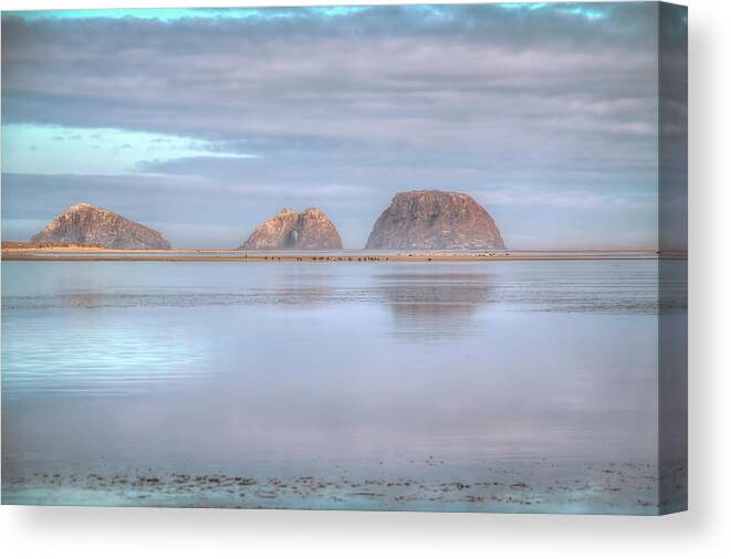 Three Arch Rocks Canvas Print featuring the photograph Across the Bay by Kristina Rinell