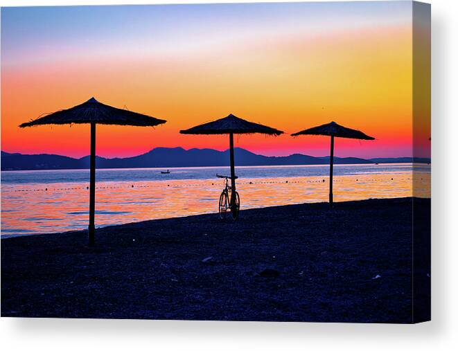 Zadar Canvas Print featuring the photograph Beach and parasols on colorful sunset view by Brch Photography