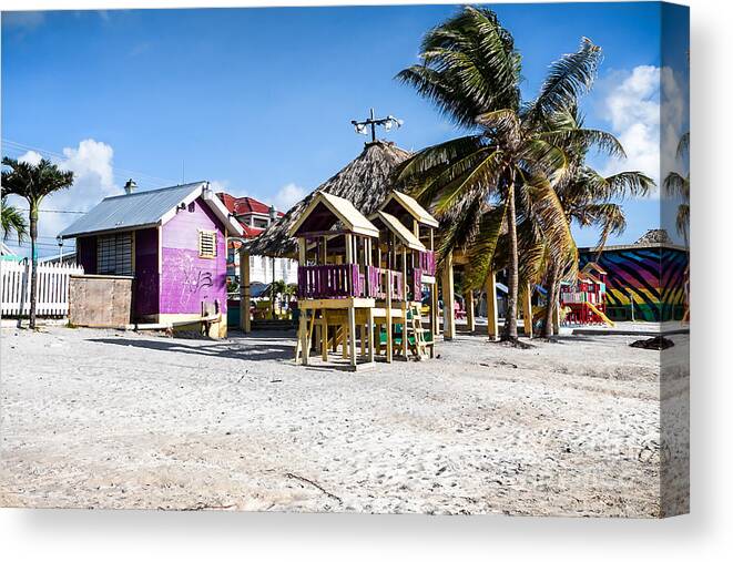 Ambergris Caye Canvas Print featuring the photograph Beach Huts by Lawrence Burry