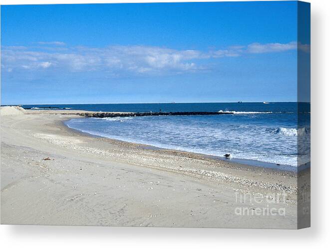 Breakwater Canvas Print featuring the photograph Beach With Jetty by John Kaprielian