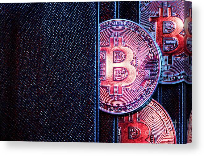 Money Canvas Print featuring the photograph Bitcoin coins sticking out of a wallet. by Michal Bednarek