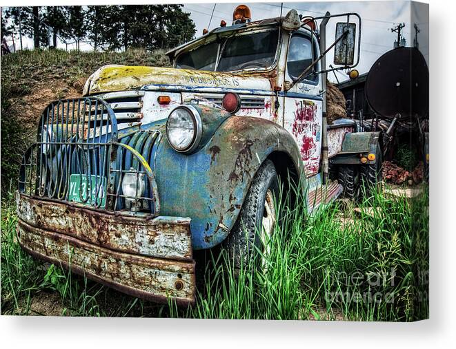 Rusty Cars Canvas Print featuring the photograph Business is Picking Up by John Strong