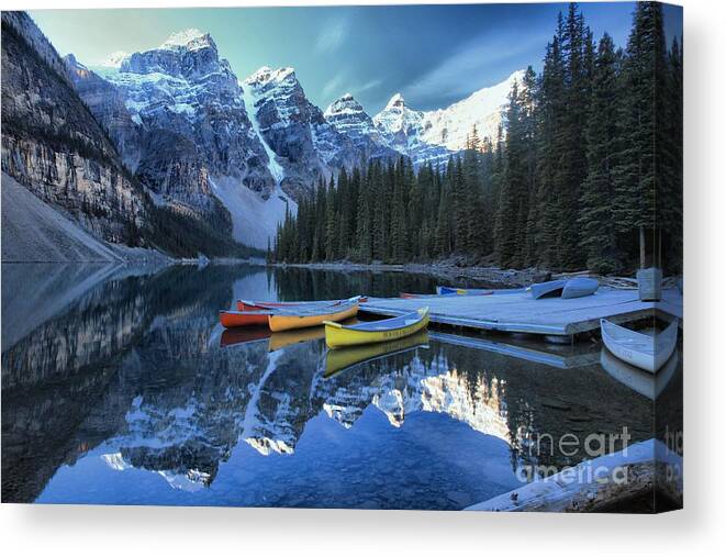 Moraine Lake Canvas Print featuring the photograph Canoes In Moraine by Adam Jewell