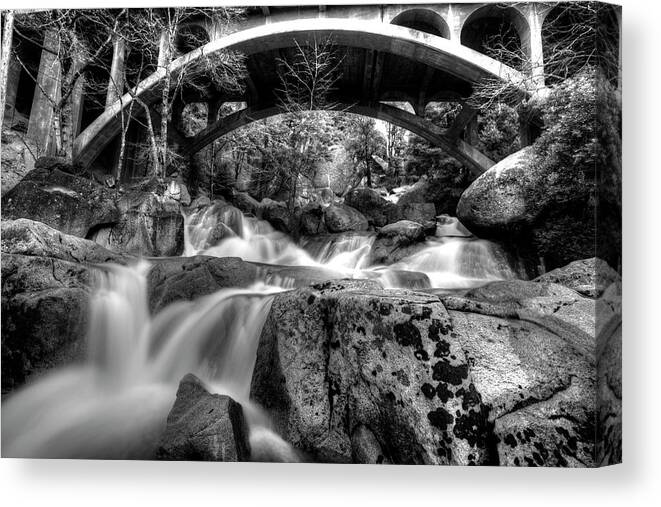 Black And White Canvas Print featuring the photograph Cascade Underbridge by David Andersen