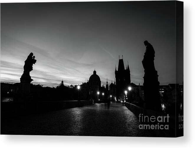 Prague Canvas Print featuring the photograph Charles Bridge at sunrise, Prague, Czech Republic. Statues, medieval towers in black and white by Michal Bednarek