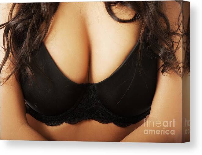 Close up on female boobs in black bra Poster by Piotr Marcinski - Fine Art  America