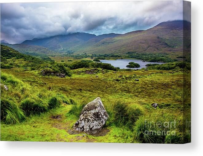 Ireland Canvas Print featuring the photograph Cloudy Hills and Lake in Ireland by Andreas Berthold