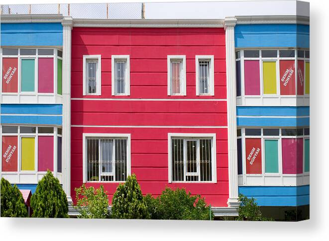 Architecture Canvas Print featuring the photograph Colorful building by Tom Gowanlock