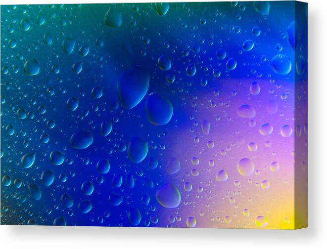 Abstract Canvas Print featuring the photograph Colorfull Water drop background abstract by Michalakis Ppalis