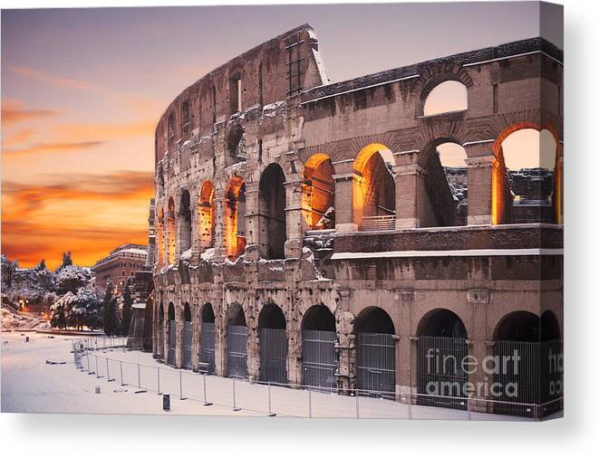 Colosseum Sunset Canvas Print featuring the photograph Colosseum covered in snow at sunset by Stefano Senise