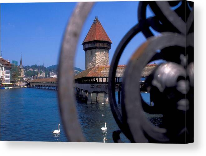 Swans Canvas Print featuring the photograph Covered Bridge in Lucerne in Switzerland by Carl Purcell