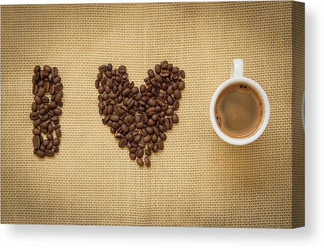 Cafe Canvas Print featuring the photograph Cup of fresh espresso coffee and beans by Michalakis Ppalis