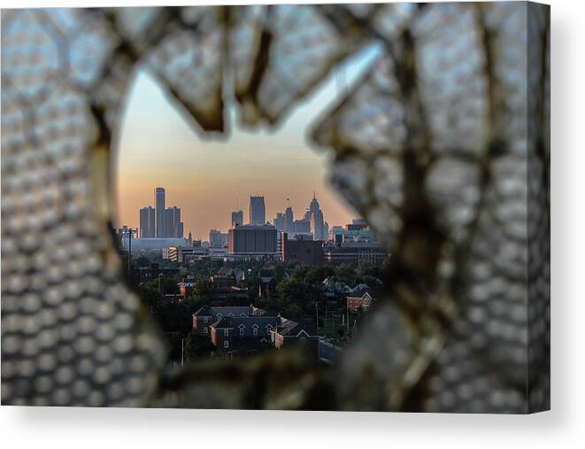 Detroit Canvas Print featuring the photograph Detroit through the broken glass of Fisher Body 21... by Jay Smith