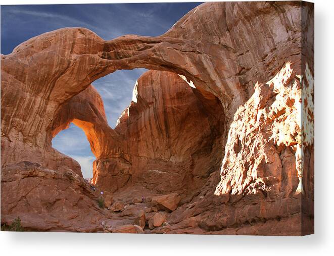 Desert Canvas Print featuring the photograph Double Arch in Late Afternoon by Mike McGlothlen