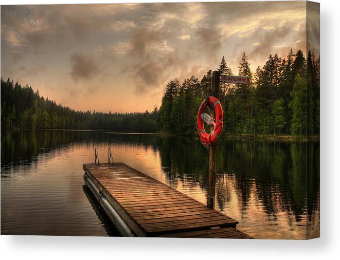 Background Canvas Print featuring the photograph Dramatic sunset on a lake in Finland by Sandra Rugina