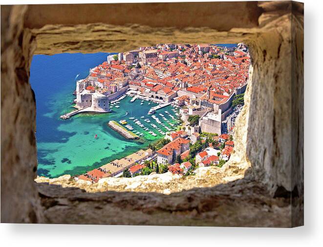 Dubrovnik Canvas Print featuring the photograph Dubrovnik historic city and harbor aerial view through stone win by Brch Photography