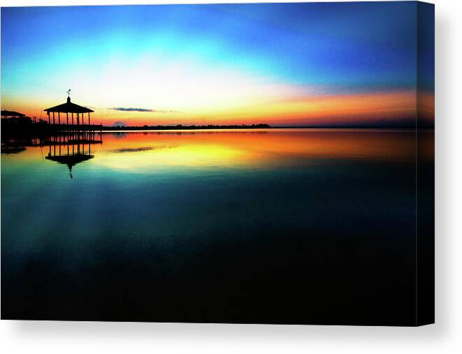 Clouds Canvas Print featuring the photograph Early Morning Rays over the Boat House by Debra and Dave Vanderlaan