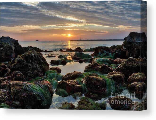 First Canvas Print featuring the photograph First Sunset of 2018 by Eddie Yerkish