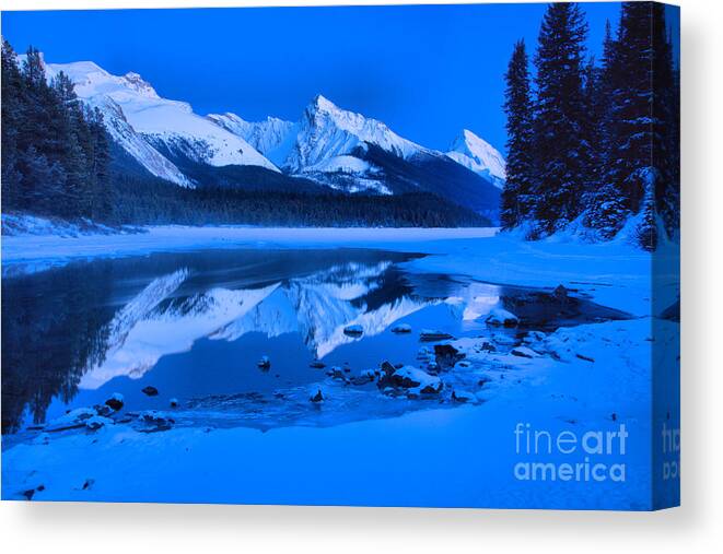 Maligne Lake Canvas Print featuring the photograph Frigid Winter Evening At Maligne Lake by Adam Jewell
