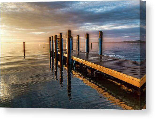 Higgins Lake Sunrise Canvas Print featuring the photograph Glowing Dock by Joe Holley