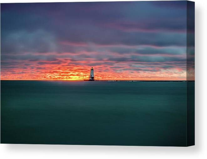 Ludington Mi Canvas Print featuring the photograph Glowing Sunset on Lake With Lighthouse by Lester Plank