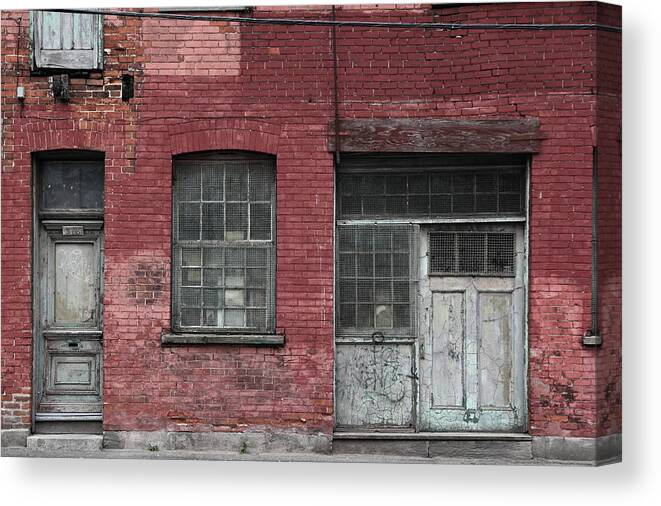 Decay Canvas Print featuring the photograph Griffintown Wall by Kreddible Trout