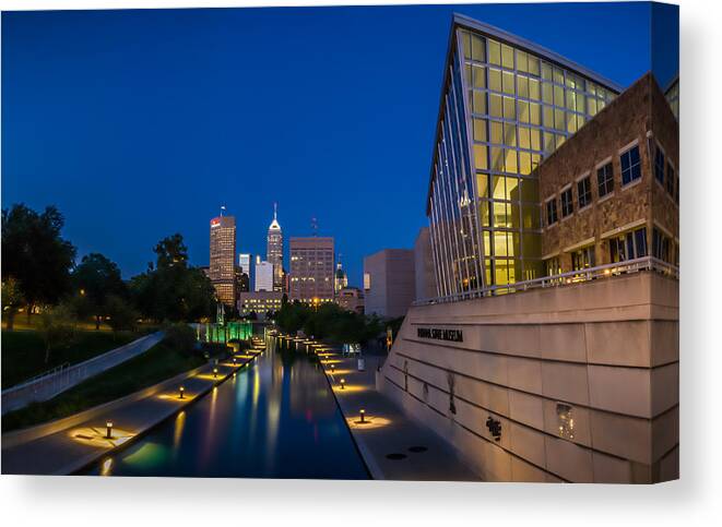 Art Canvas Print featuring the photograph Indianapolis Skyline from the Canal at Night by Ron Pate
