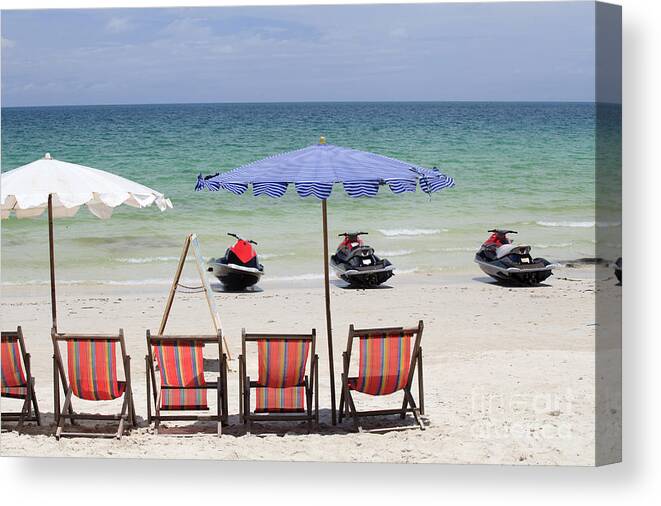 Adult Canvas Print featuring the photograph Jet Ski and deck chair by Anek Suwannaphoom