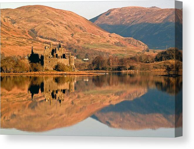 Scotland Canvas Print featuring the photograph Kilchurn Castle in Autumn by John McKinlay