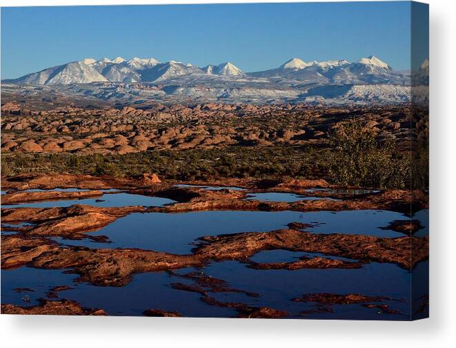 Polholes Canvas Print featuring the photograph La Sal Mountains and Ephemeral Pools by Tranquil Light Photography