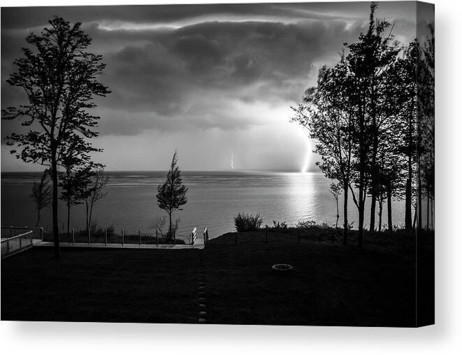 Landscapes Canvas Print featuring the photograph Lightning on Lake Michigan at Night in BW by Mary Lee Dereske